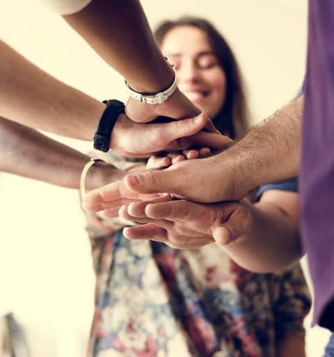 Group-of-diverse-people-joined-hands-together mobile