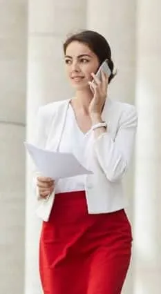 Businesswoman-Speaking-by-Phone-Outdoors mobile