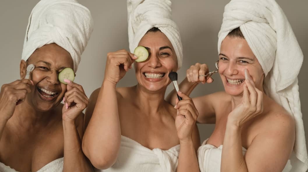 Happy females having skin care spa day