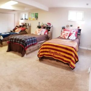 room with three single beds