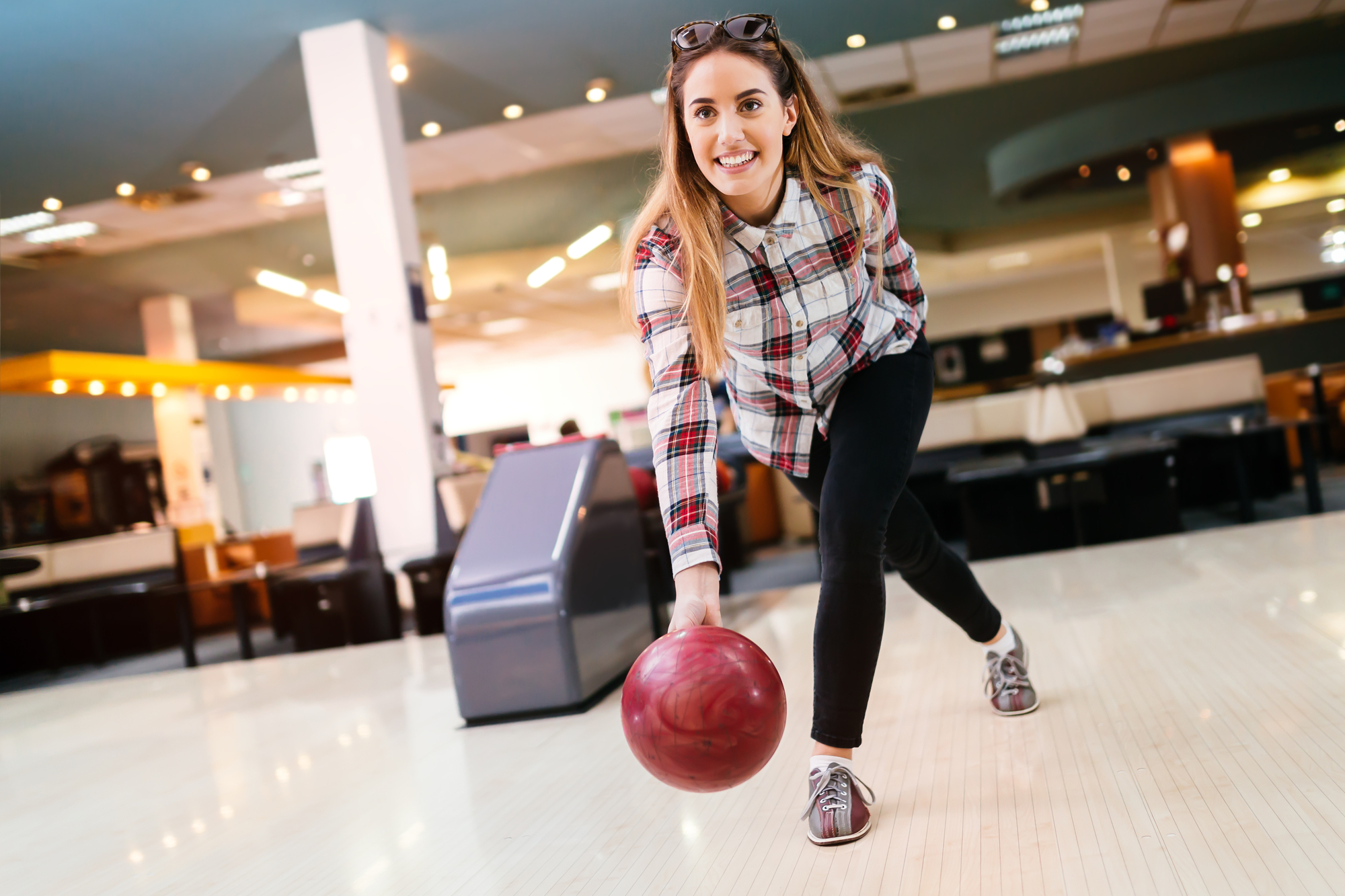 woman about to release a bowling ball