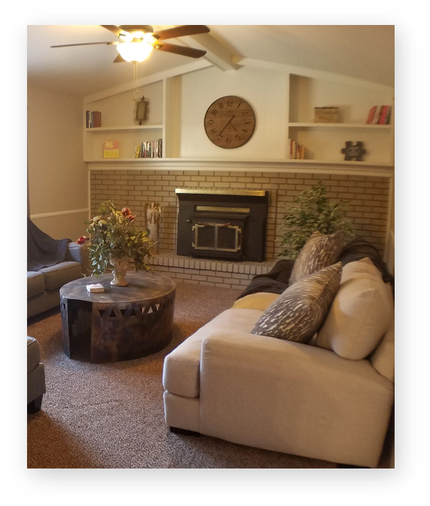 living room with fireplace in Denver sober living house