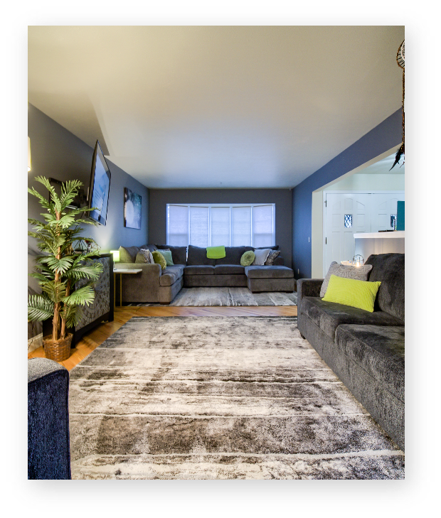 living room with flat screen TV in Denver sober living house