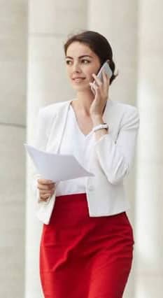 Businesswoman-Speaking-by-Phone-Outdoors mobile