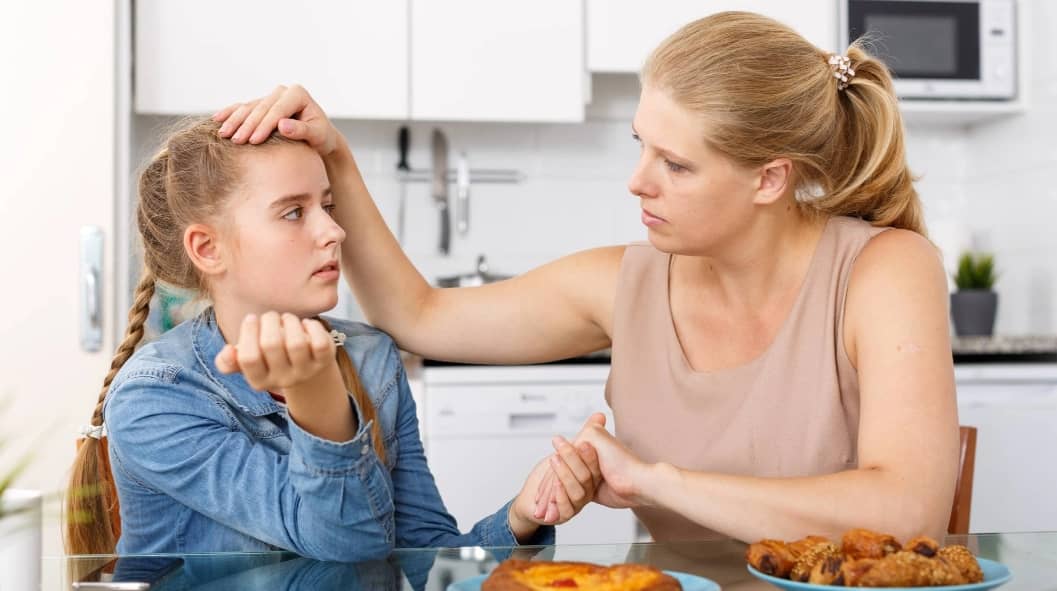 Mother and daughter having conversation
