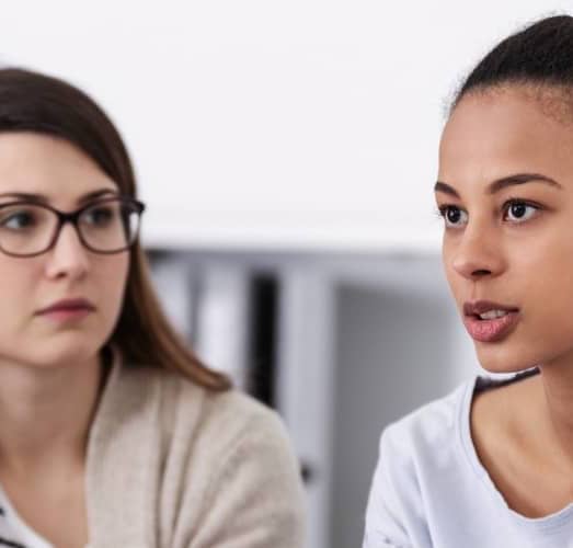 women-supporting-each-other-during-psychotherapy-group-meeting mobile