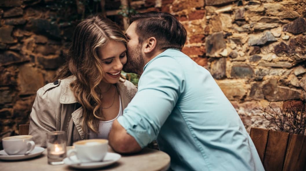 Smiling couple at a coffee shop spending time together